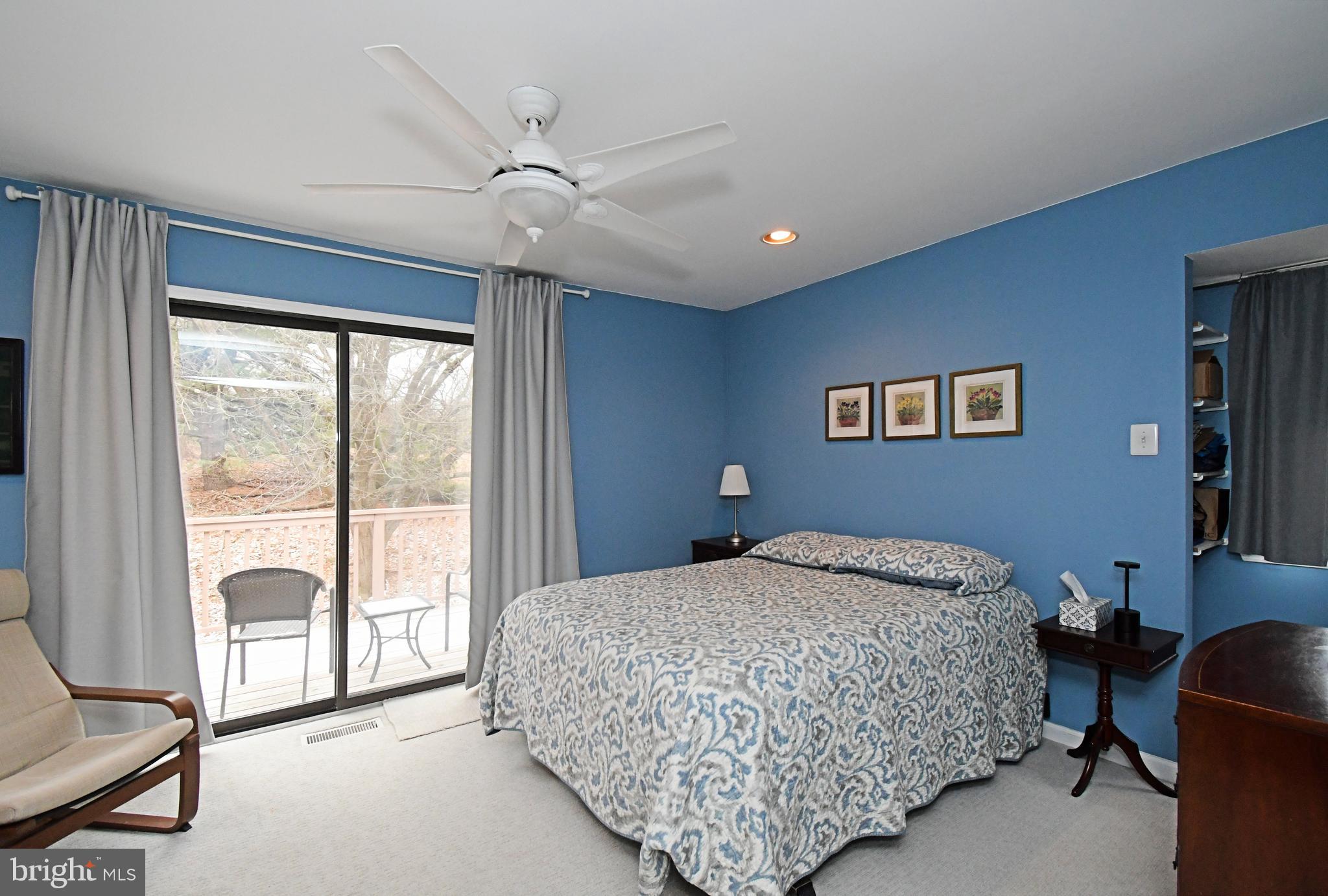 28 Flintlock Lane Chesterbrook, PA 19087 - Photo 51 of 69 a living room with a bed furniture and a large window