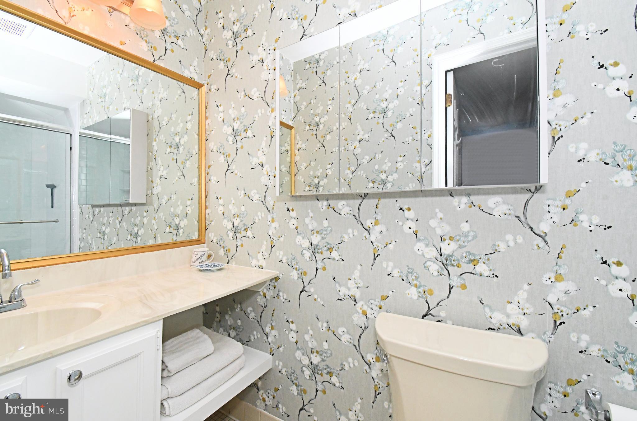 28 Flintlock Lane Chesterbrook, PA 19087 - Photo 56 of 69 a bathroom with a sink a toilet and shower curtain