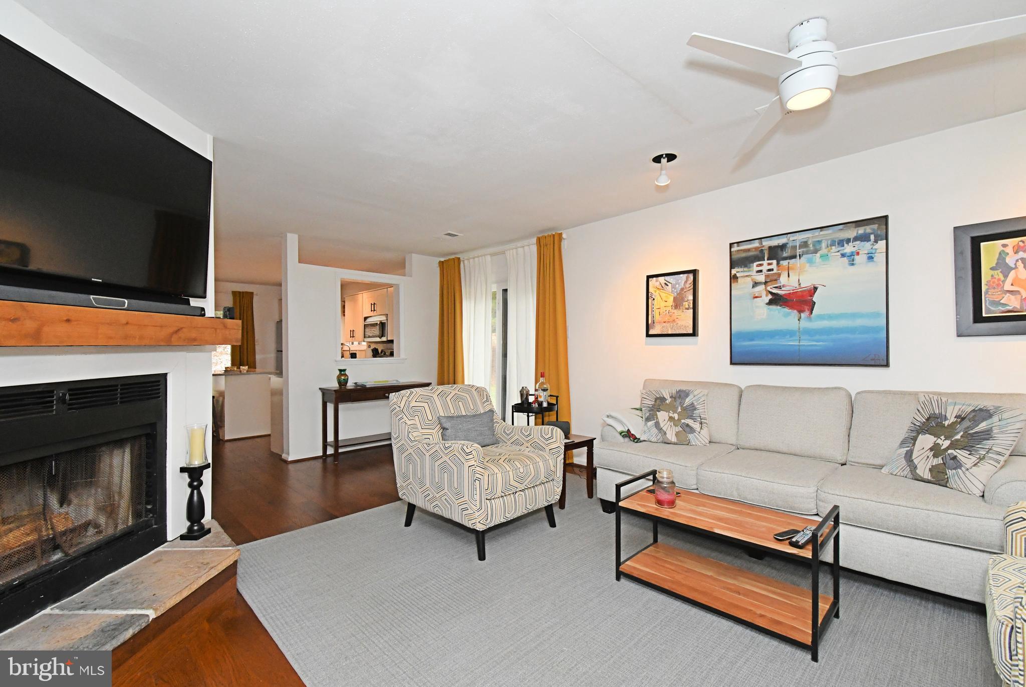 28 Flintlock Lane Chesterbrook, PA 19087 - Photo 8 of 69 a living room with furniture flat screen tv and a fireplace
