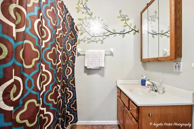 a bathroom with a sink and a mirror