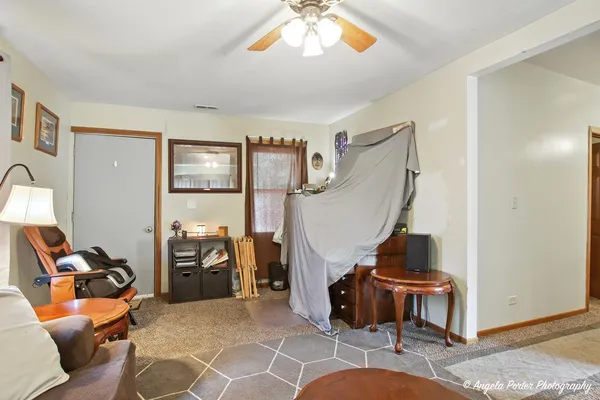 a view of a livingroom with furniture and a livingroom