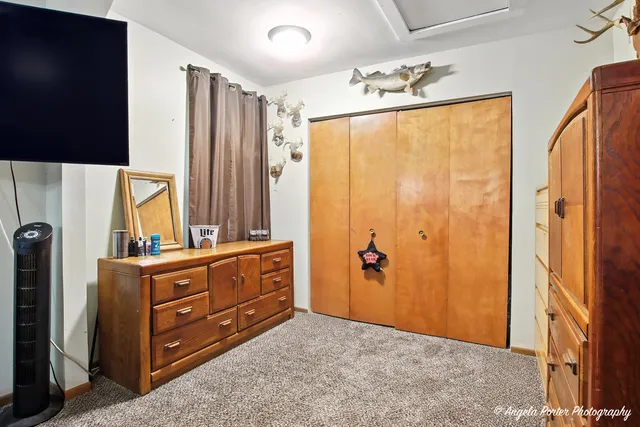 a bathroom with a granite countertop sink mirror and shower