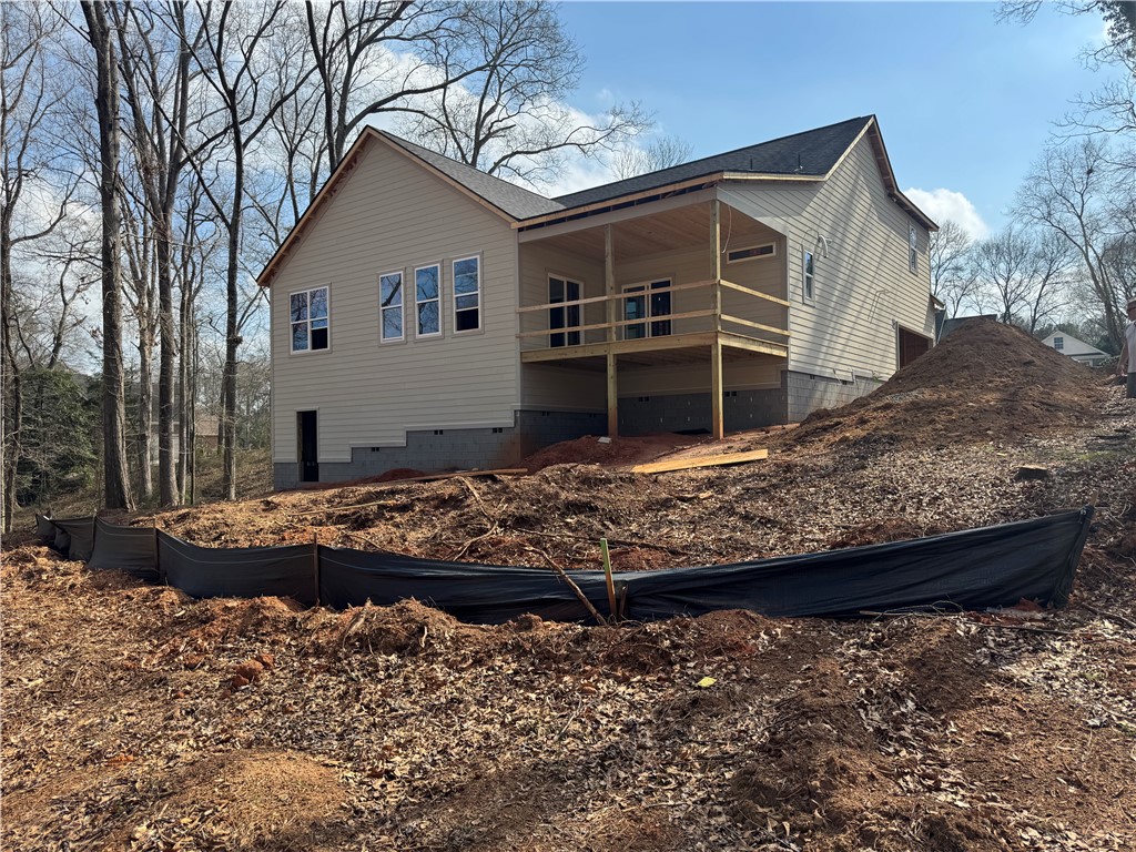 513 Quail Hollow Road Anderson, SC 29621 - Photo 36 of 39 This new construction home features a welcoming covered deck and ample yard space, perfect for outdoor living.