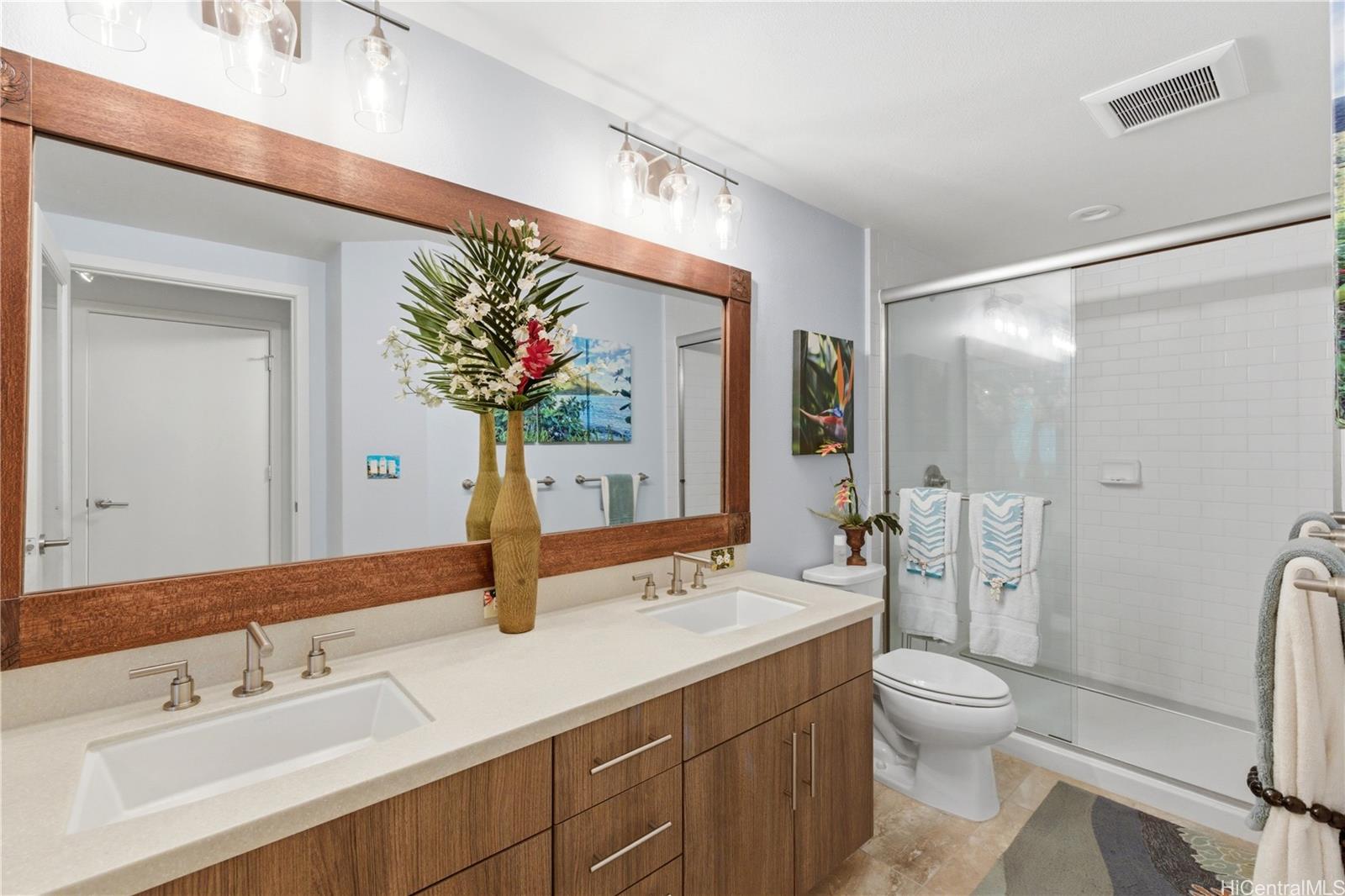 437 Kailua Road, Unit 6108 Kailua, HI 96734 - Photo 14 of 25 The primary bathroom features double sinks with generous storage below, a wide shower, and tile flooring.