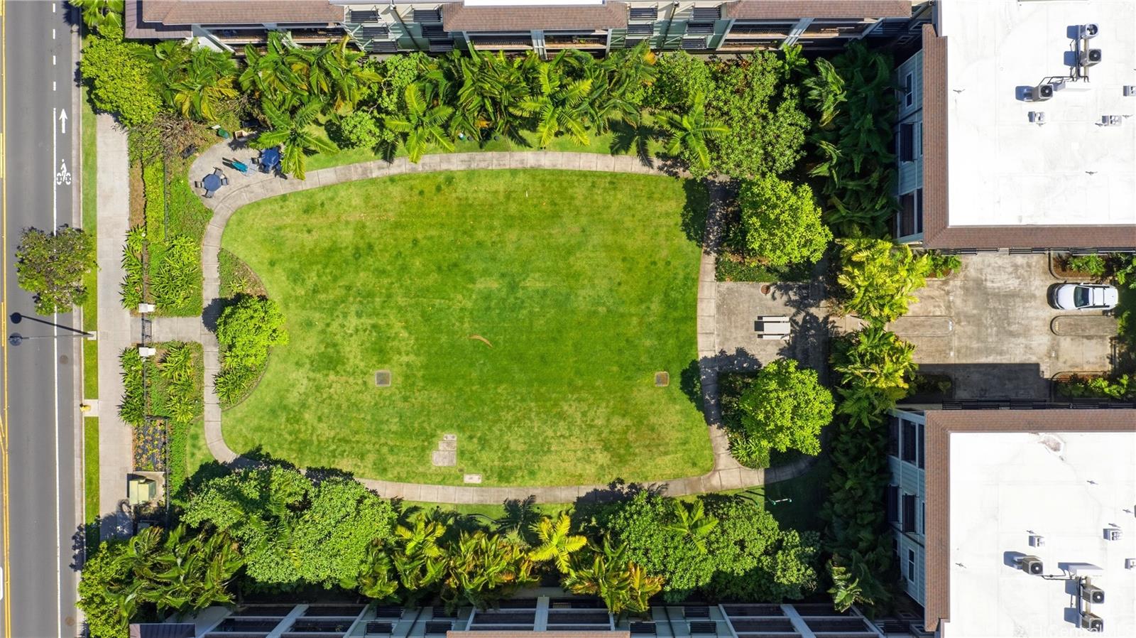 437 Kailua Road, Unit 6108 Kailua, HI 96734 - Photo 20 of 25 Lanai overlooks the garden courtyard with nearby BBQ and workout stations.