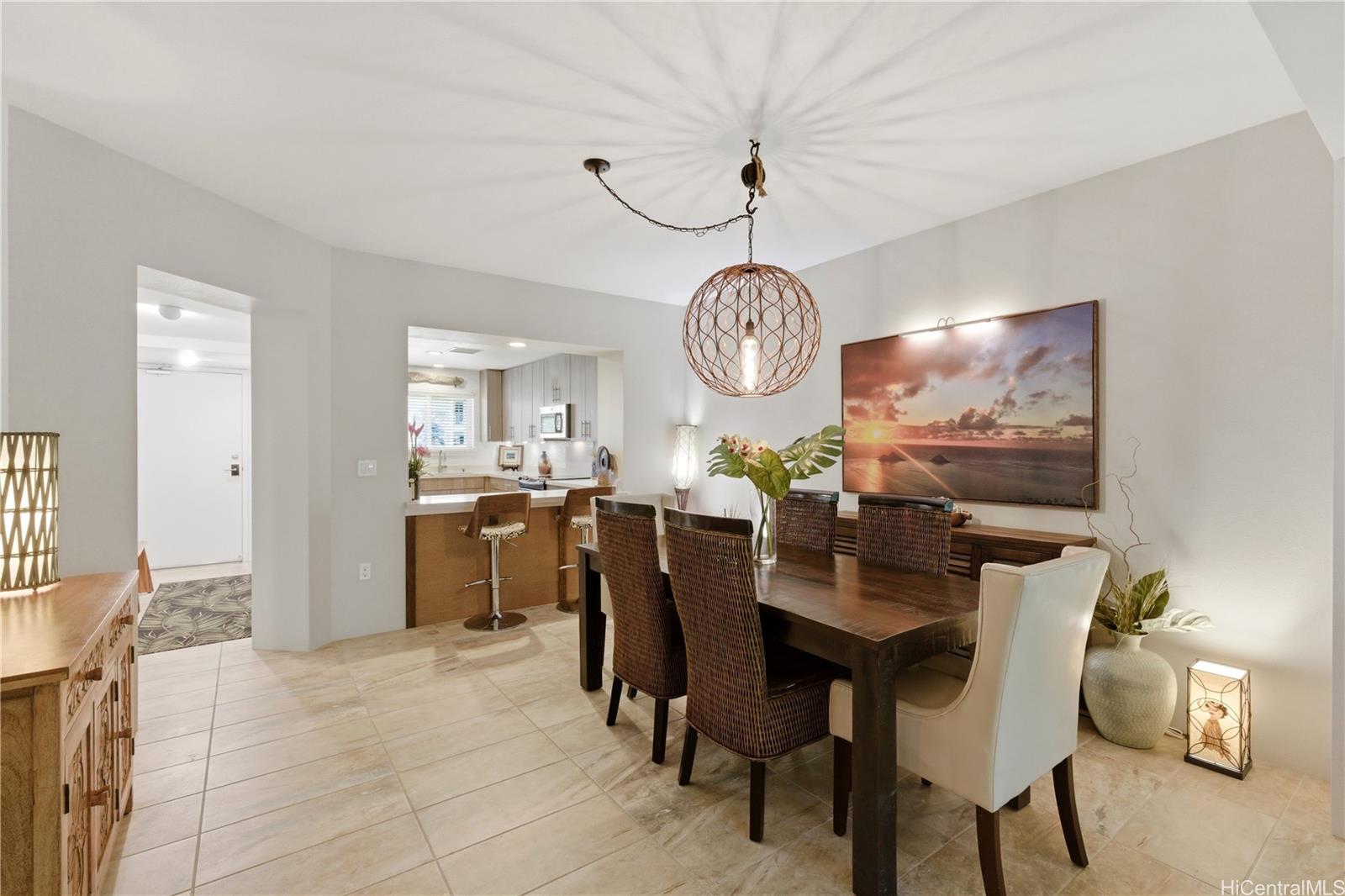 437 Kailua Road, Unit 6108 Kailua, HI 96734 - Photo 2 of 25 The foyer entry welcomes you into the condo, leading to the kitchen, second bedroom, bathroom, and dining area. (Furnishings negotiable.)