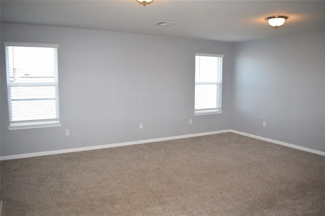 an empty room that has a window