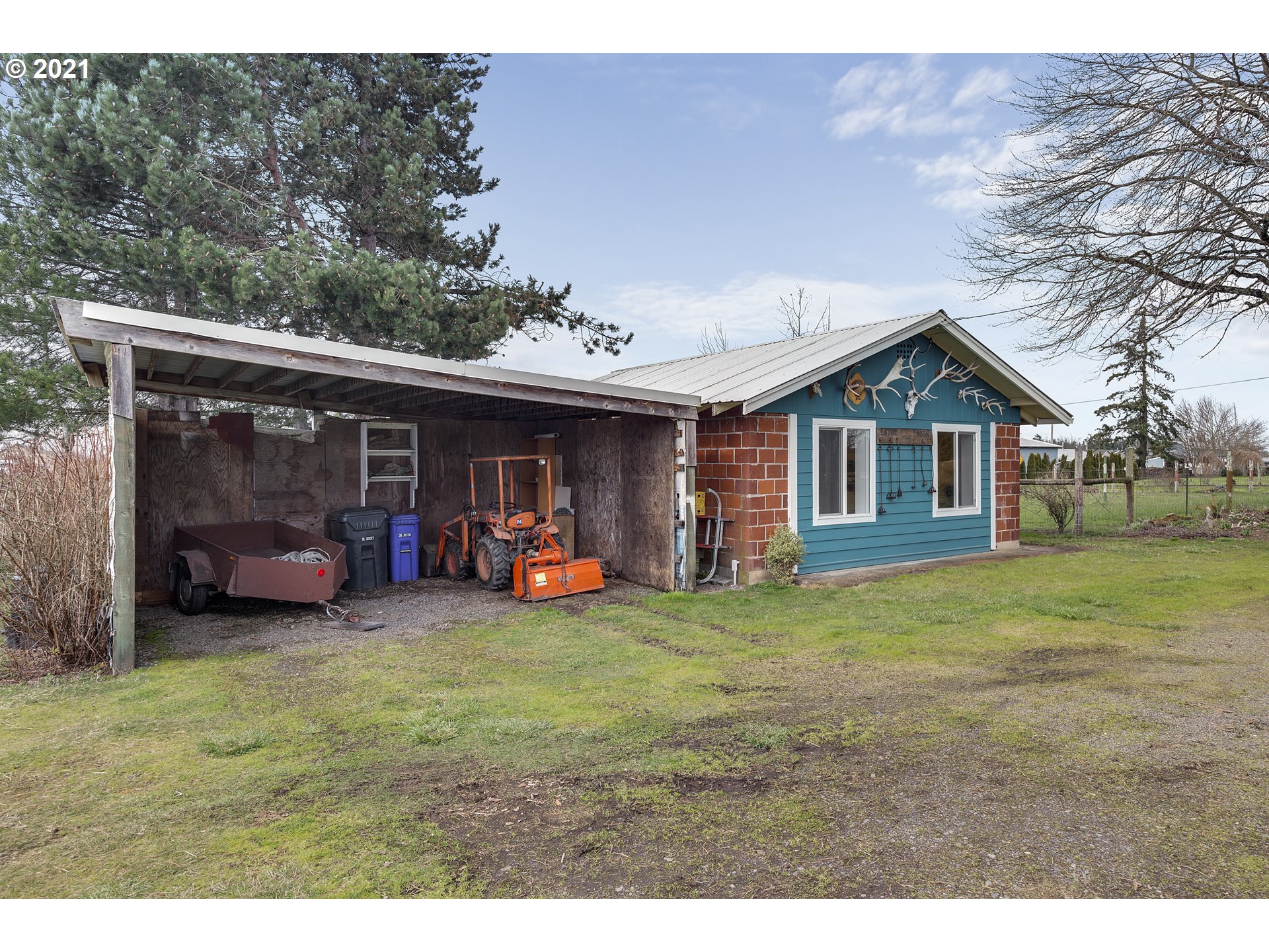7150 South Barnards Road Canby, OR 97013 - Photo 26 of 32 a view of a house with a yard and sitting area
