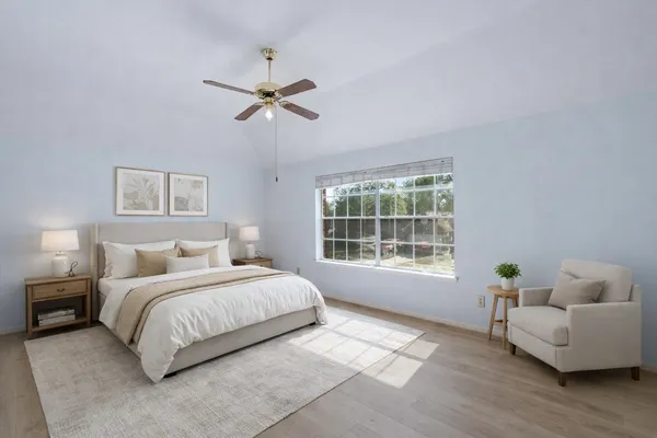 a bedroom with a bed and a couch