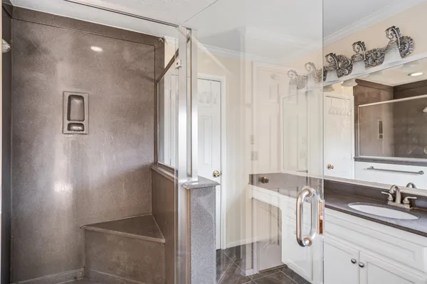 a bathroom with a sink and mirror