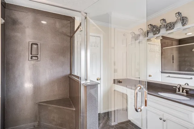 a bathroom with a sink and mirror