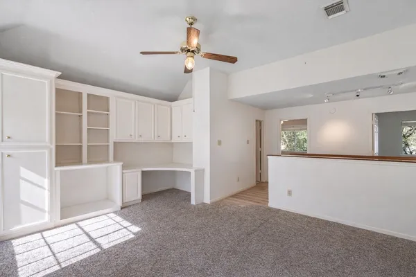 a view of workspace with cabinet and window