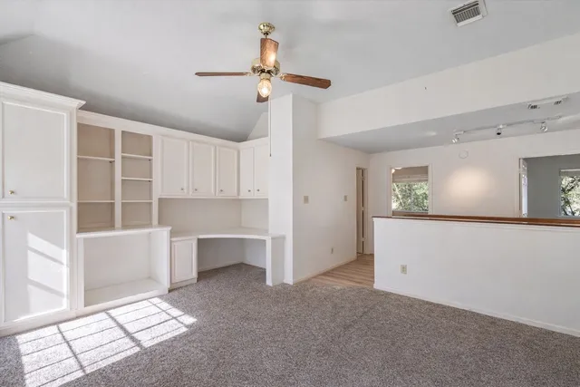 a view of workspace with cabinet and window