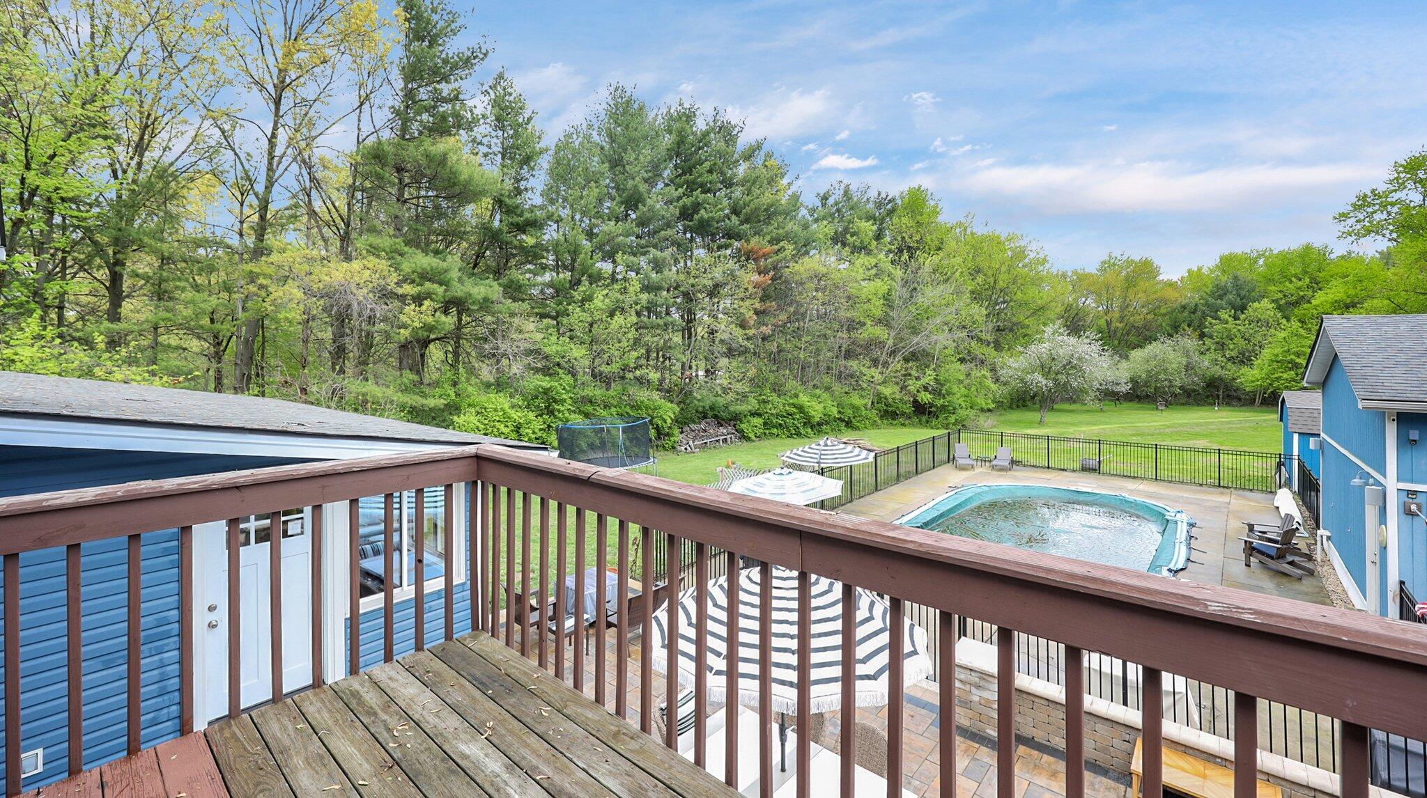 7790 Schott Road Westerville, OH 43081 - Photo 25 of 50 Owners' suite balcony overlooking the backyard, patio, and pool! Imagine drinking your morning coffee in this space!