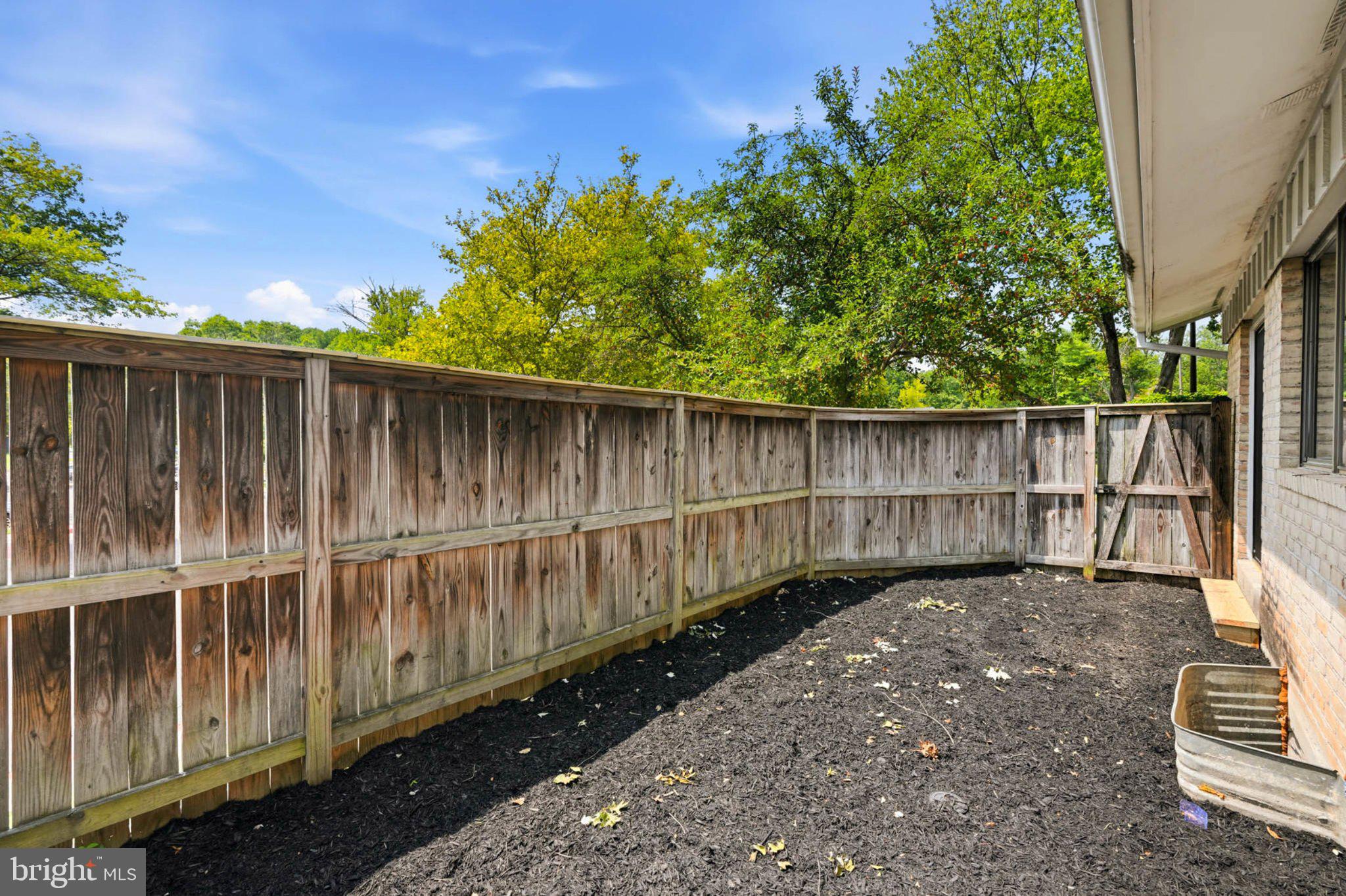 10901 Trotting Ridge Way, Unit 92 Columbia, MD 21044 - Photo 31 of 37 Serene outdoor space with lush greenery.
