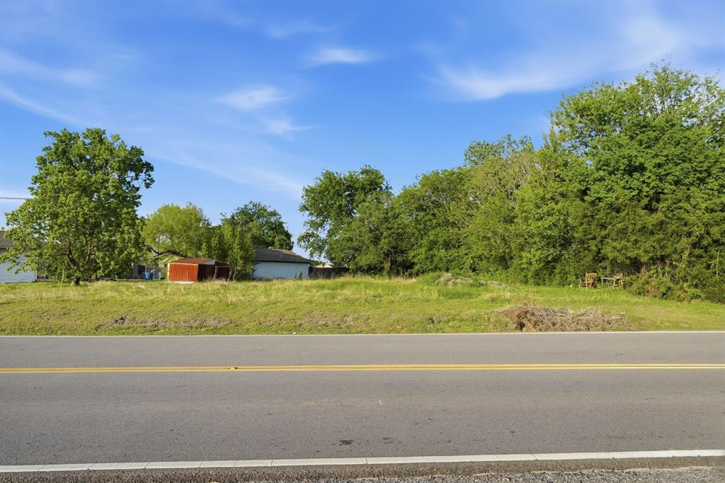 2514 Chiesa Road Rowlett, TX 75088 - Photo 19 of 19 a view of a yard and a car parked