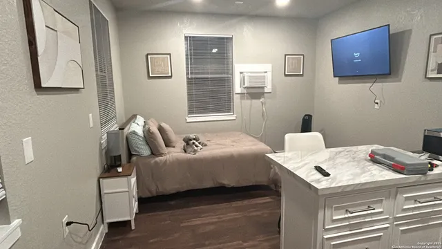 a bedroom with a bed and furniture