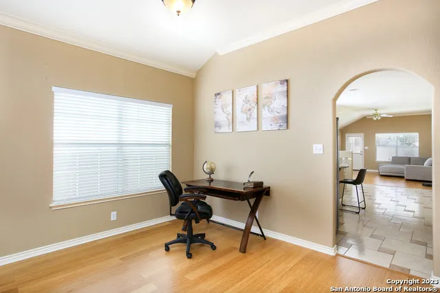 a view of a workspace with a window and dining room