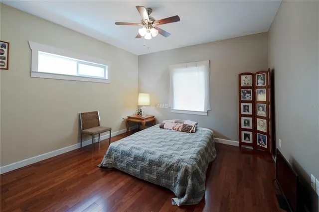 a bedroom with a bed furniture and a window
