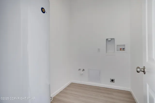 a view of a room with wooden floor