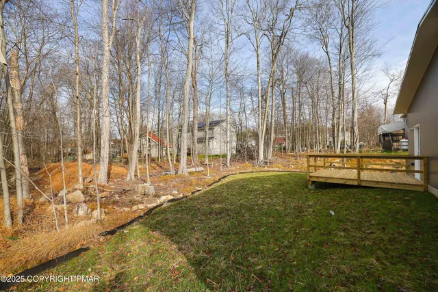 a backyard of a house with lots of green space