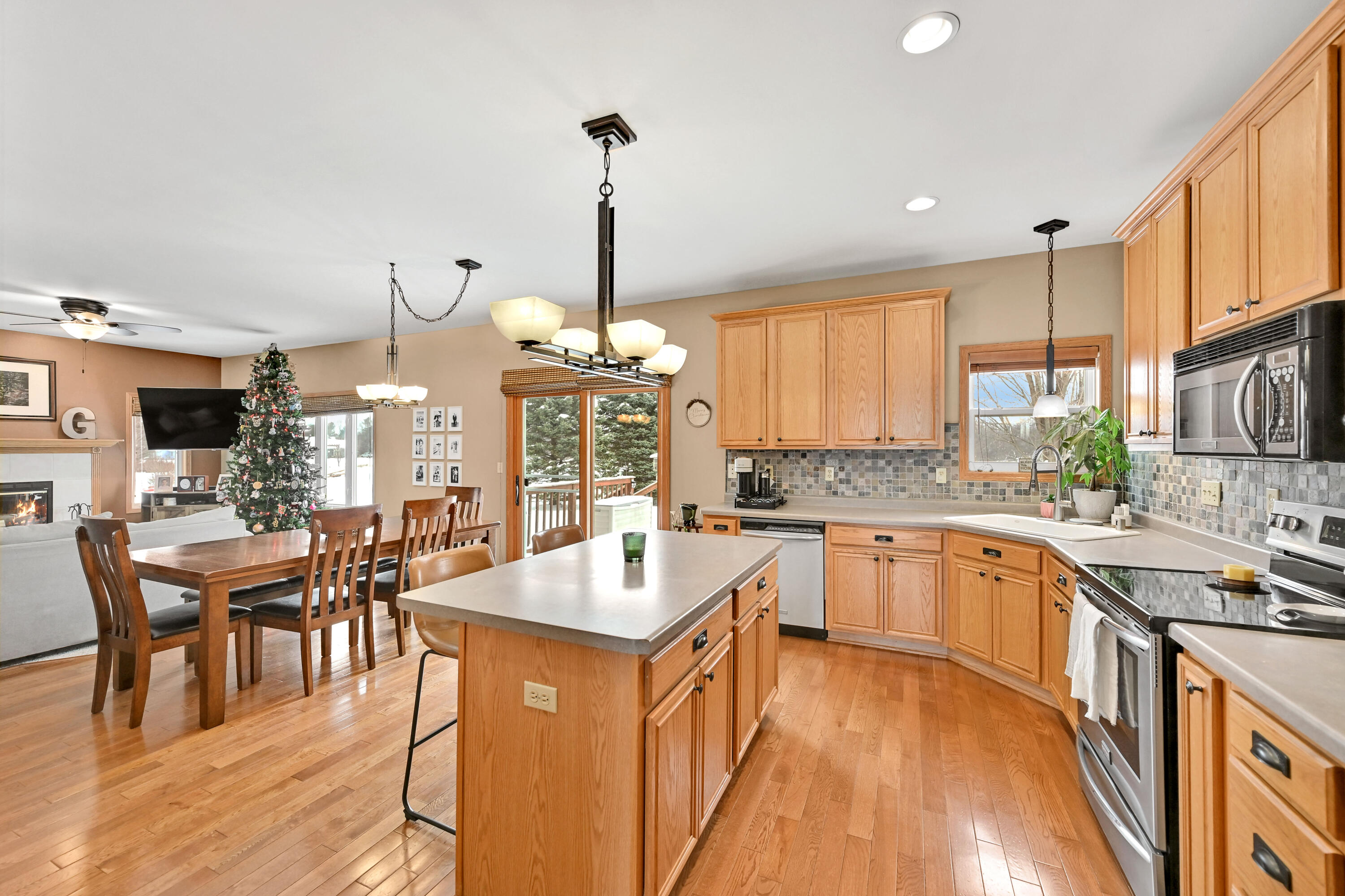 N7726 Maple Ridge Road Oconomowoc, WI 53066 - Photo 7 of 39 Center Island & Stone Backsplash