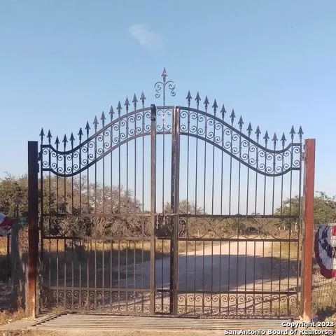 a view of a lake with beach and outdoor space