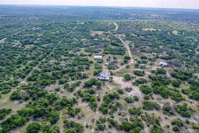 a backyard of a house with lots of green space and garden