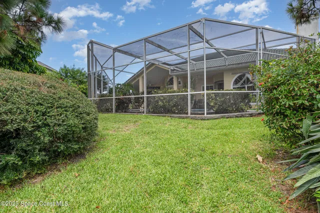 an aerial view of a house with a lake view
