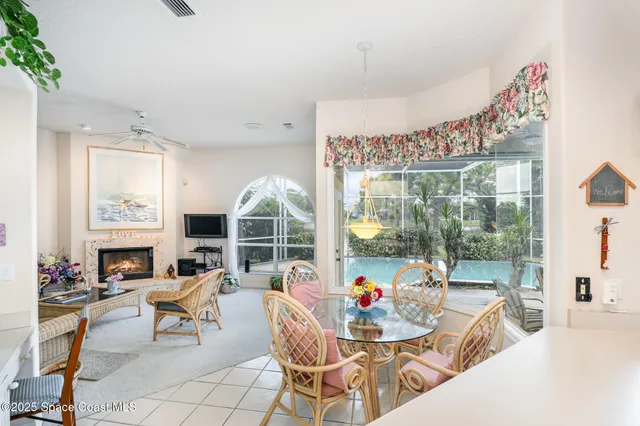 a view of a living room and a floor to ceiling window