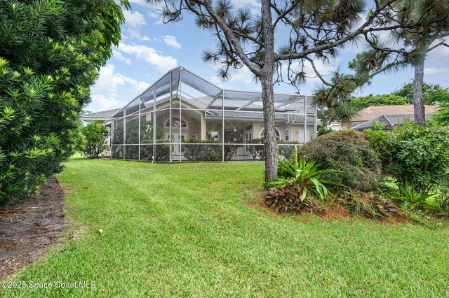 a view of a lake with houses in the back