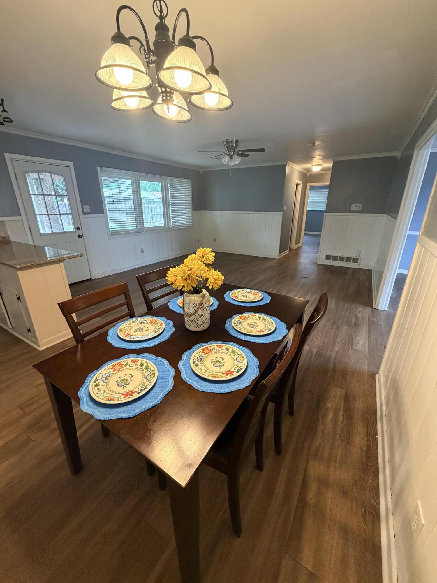3814 27th Street Lubbock, TX 79410 - Photo 8 of 24 a view of a dining room with furniture and chandelier