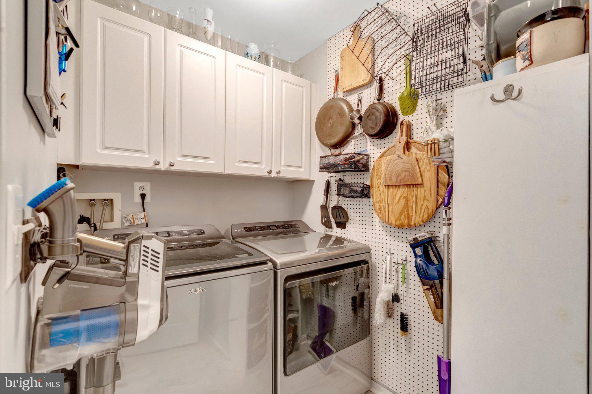 4310 Cannon Ridge Court, Unit 75 Fairfax, VA 22033 - Photo 19 of 29 Efficient laundry space with stylish storage.