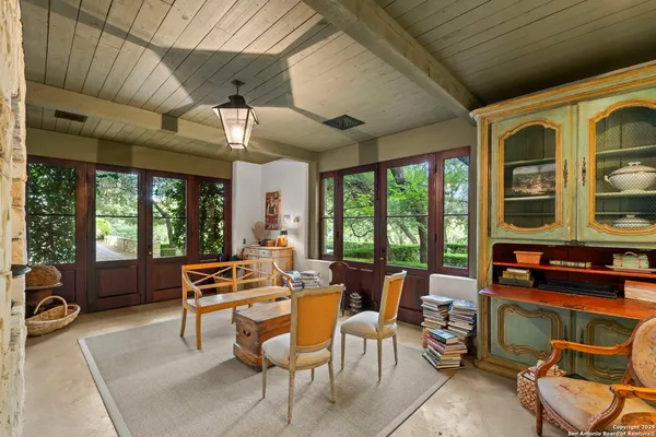 a outdoor space with lots of furniture and large windows