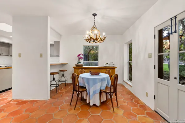 a kitchen with a stove sink and cabinets