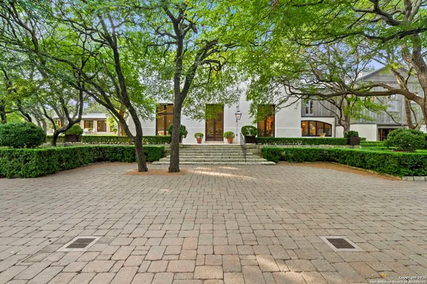a view of a backyard with swimming pool