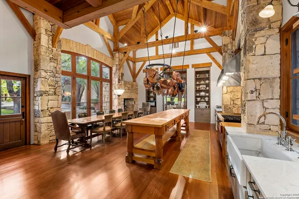 a building outdoor space with patio furniture and wooden floor