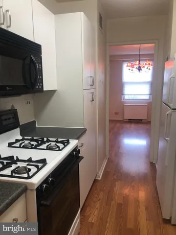 a kitchen with a stove and a microwave