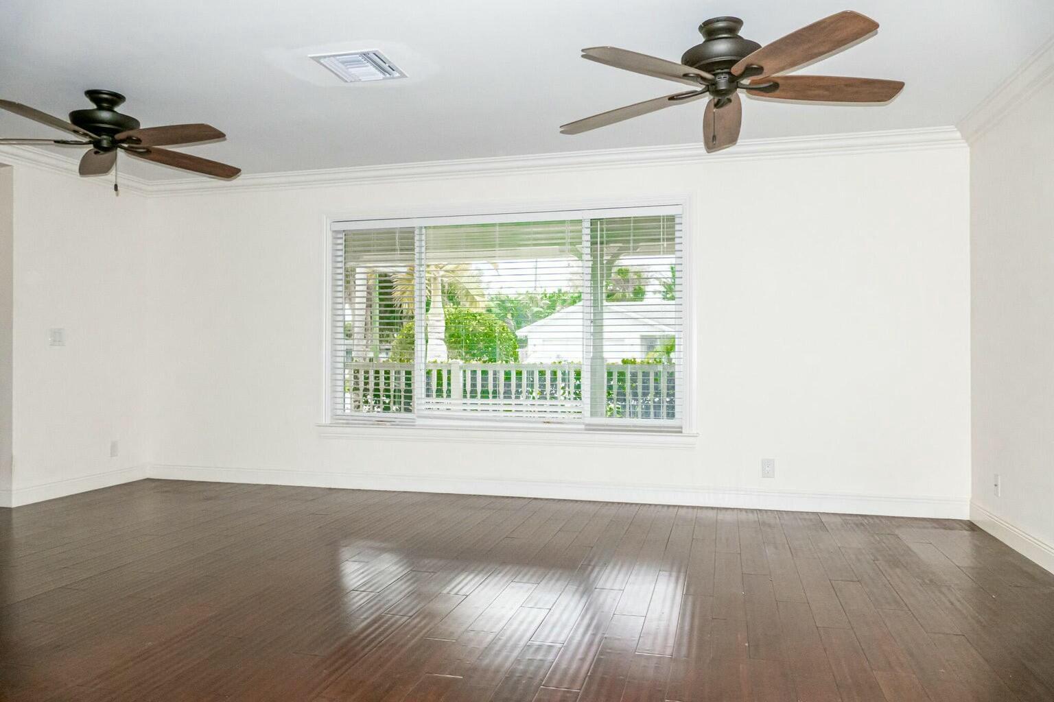 18014 Perigon Way Jupiter, FL 33458 - Photo 7 of 35 an empty room with a window and a fan