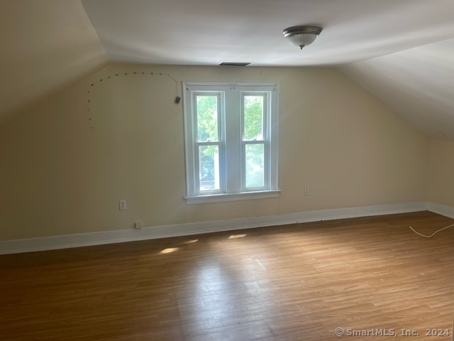 24 Arthur Street New Haven, CT 06519 - Photo 11 of 14 wooden floor in an empty room with a window