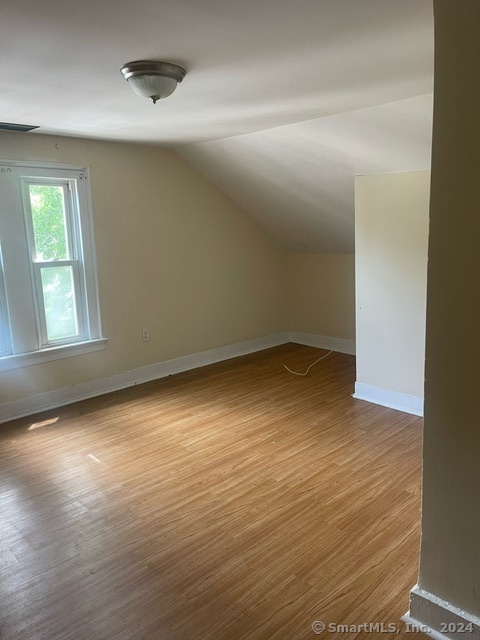 24 Arthur Street New Haven, CT 06519 - Photo 13 of 14 an empty room with wooden floor and windows