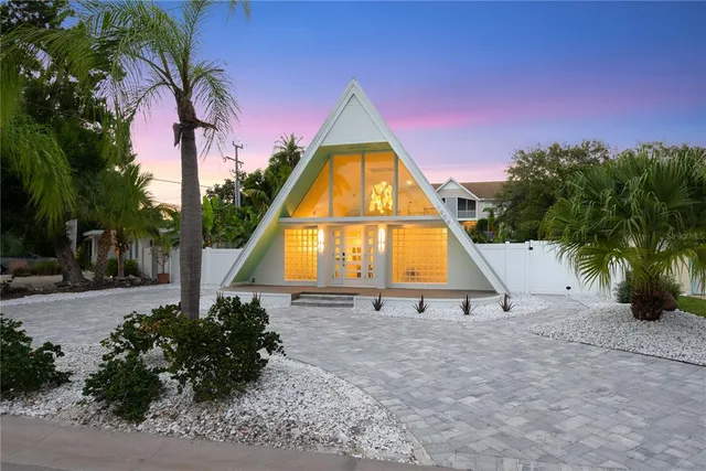 a view of backyard with swimming pool and slide