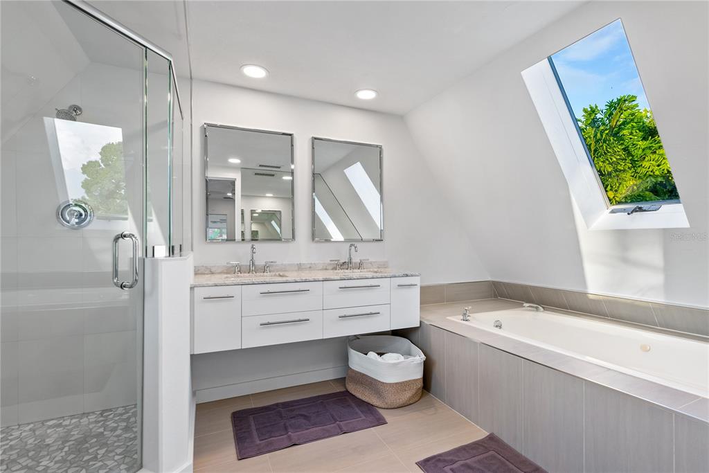 1909 High Point Drive Sarasota, FL 34236 - Photo 15 of 26 a bathroom with a bathtub sink and toilet