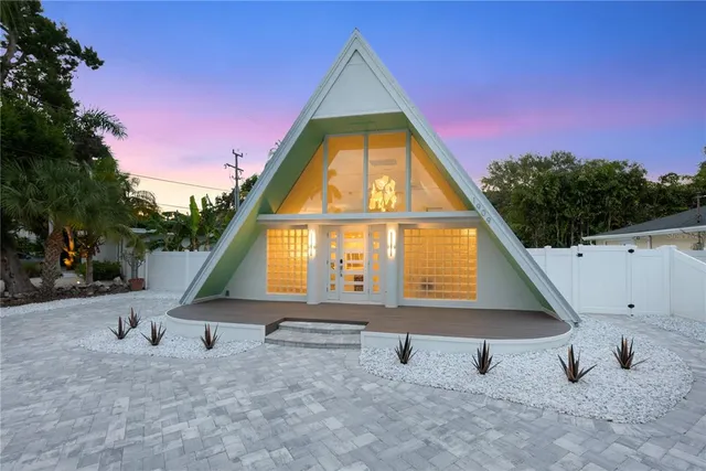 a view of garage and wooden deck