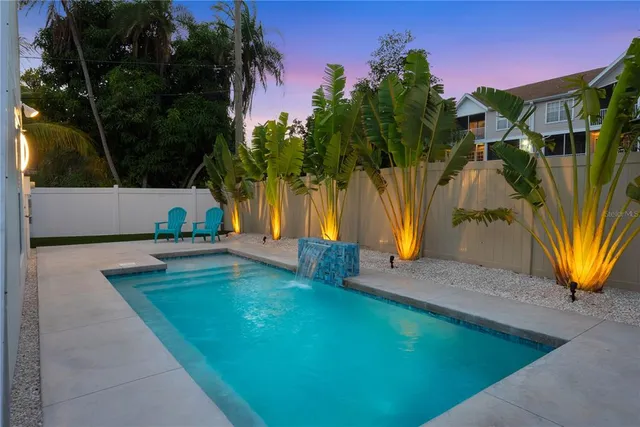 a view of a park with large trees