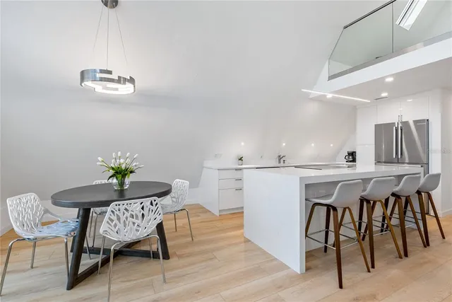 a view of kitchen with furniture and a dining table