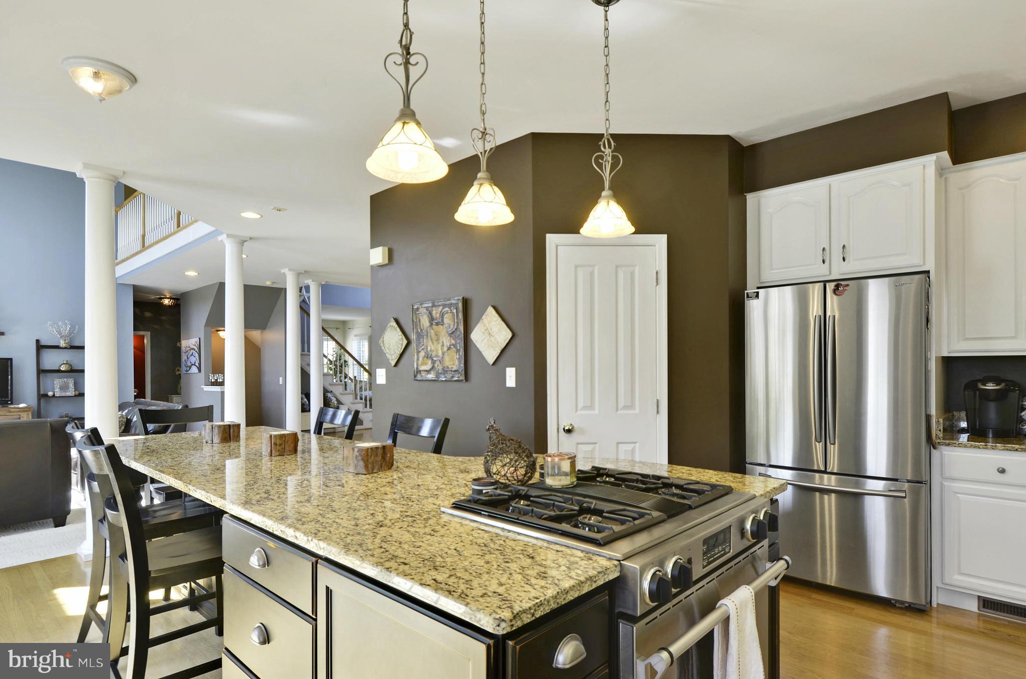1212 Walker Road Freeland, MD 21053 - Photo 14 of 30 a kitchen with stainless steel appliances granite countertop a stove refrigerator and cabinets