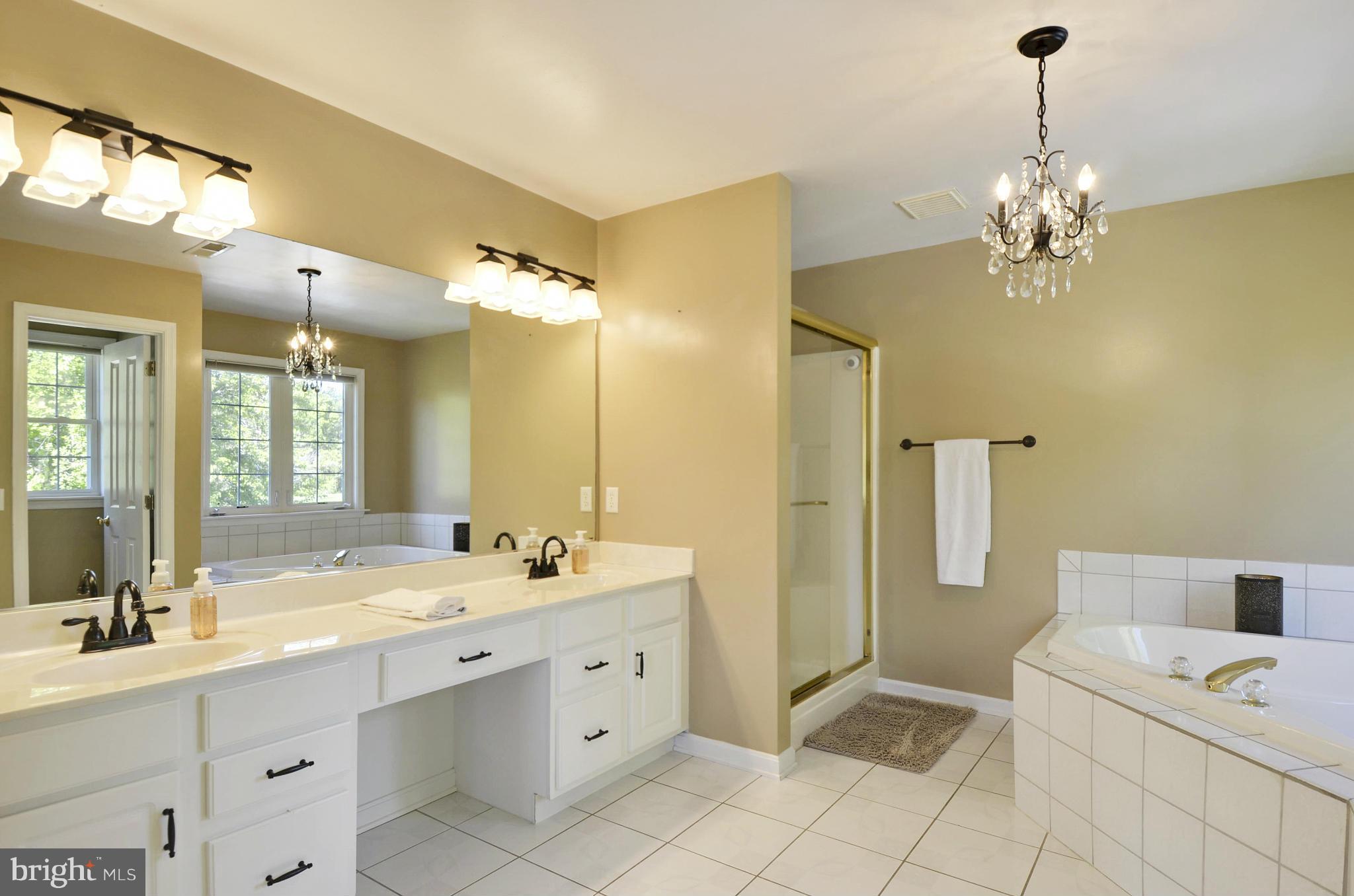 1212 Walker Road Freeland, MD 21053 - Photo 17 of 30 a bathroom with a double vanity sink mirror and
