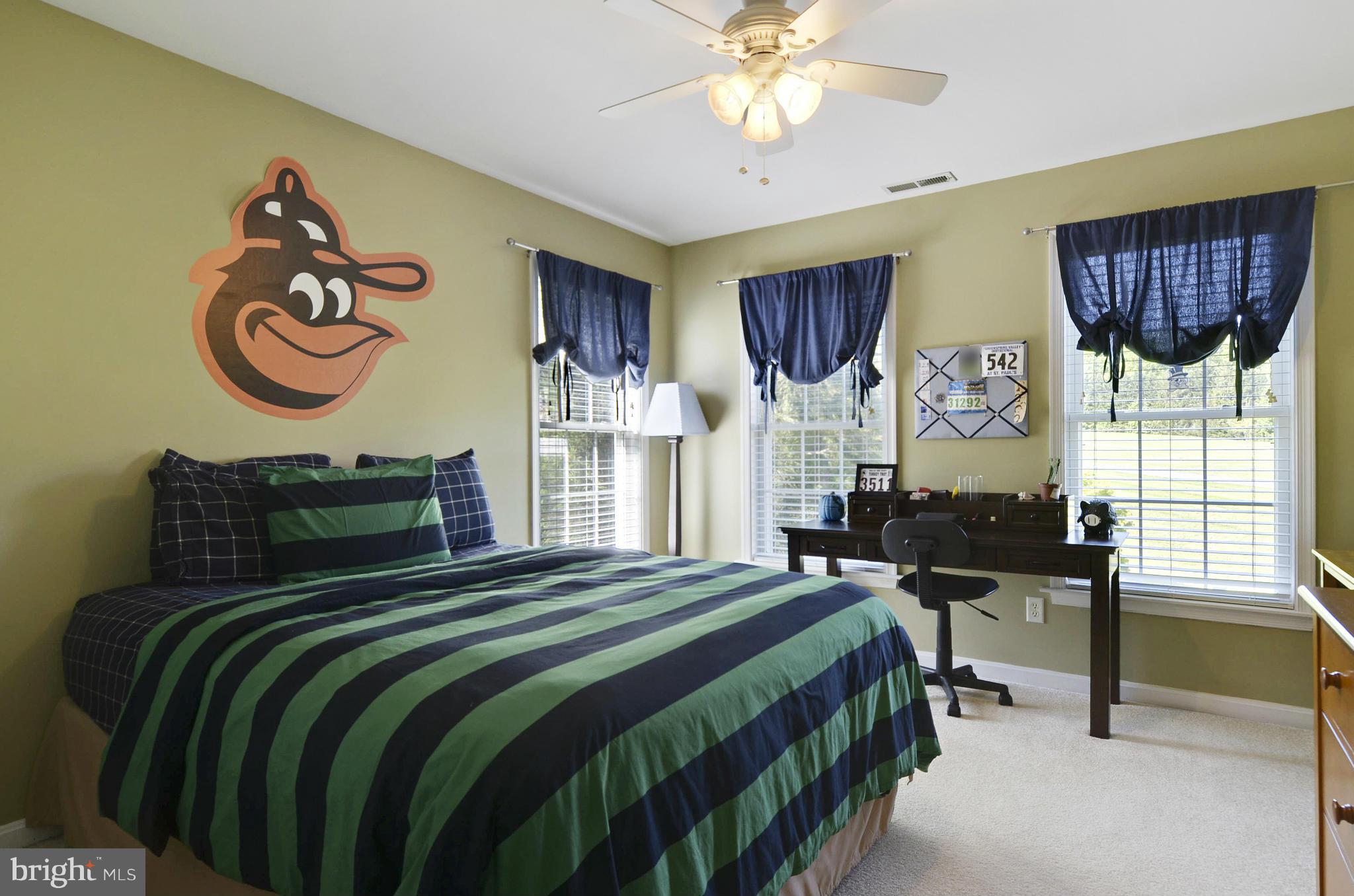 1212 Walker Road Freeland, MD 21053 - Photo 18 of 30 a bedroom with a bed and a table with chair