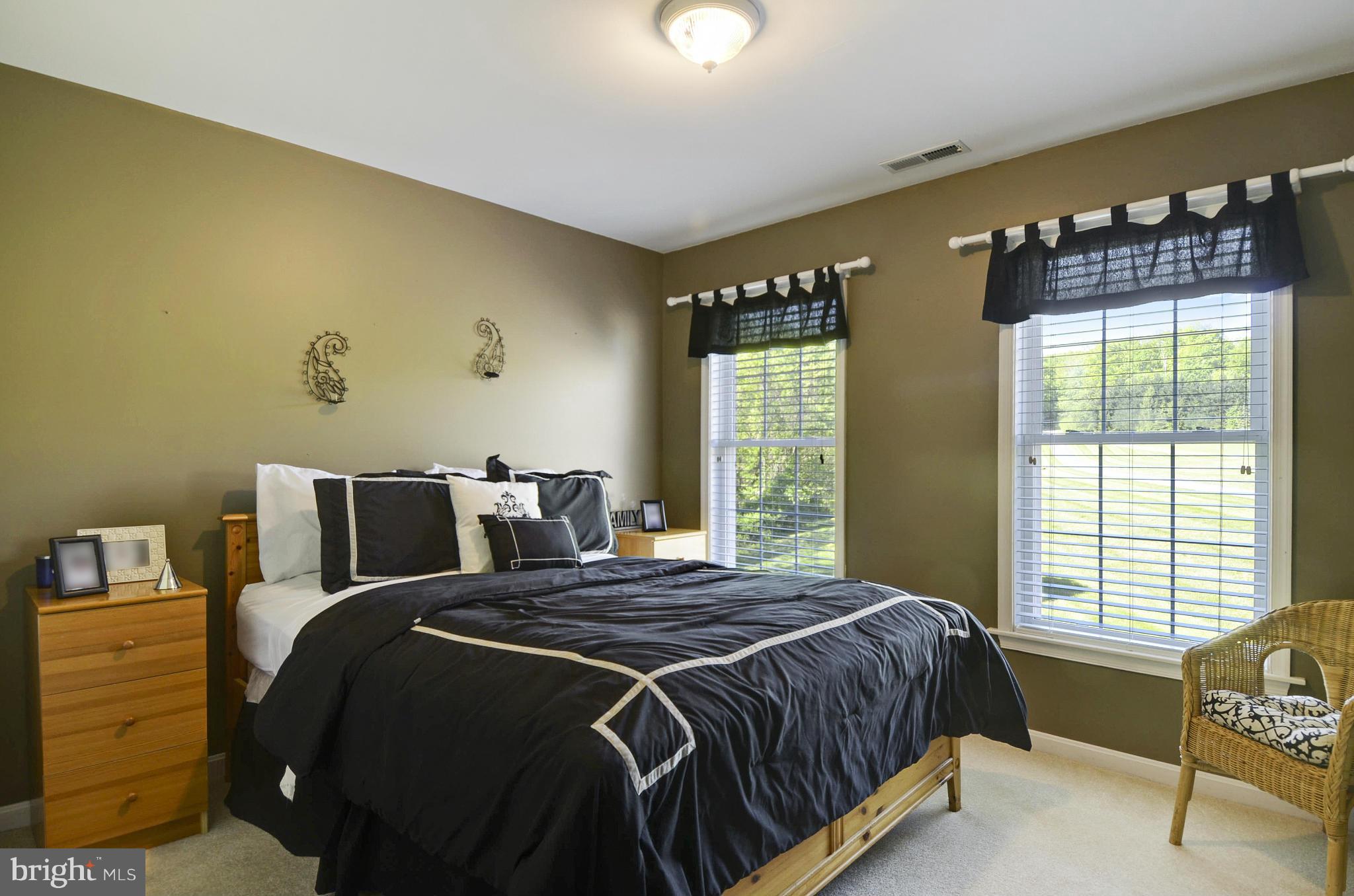1212 Walker Road Freeland, MD 21053 - Photo 19 of 30 a bed sitting in a bedroom next to a window